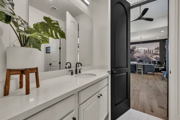 Discover luxury real estate photography in a stunning home on E Hummingbird Way, Gilbert, AZ, showcasing a modern bathroom design.