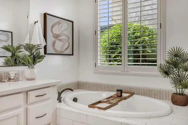 This exquisite bathroom in Mesa, AZ, features elegant decor with a luxurious tub, highlighting premium real estate photography.