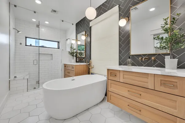 Discover luxury real estate photography showcasing a stunning bathroom in Phoenix, AZ, featuring a sleek freestanding tub and contemporary design.