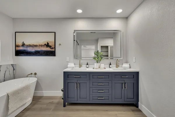 This Scottsdale, AZ home features elegant real estate photography showcasing a contemporary bathroom with a modern vanity and luxury bathtub.
