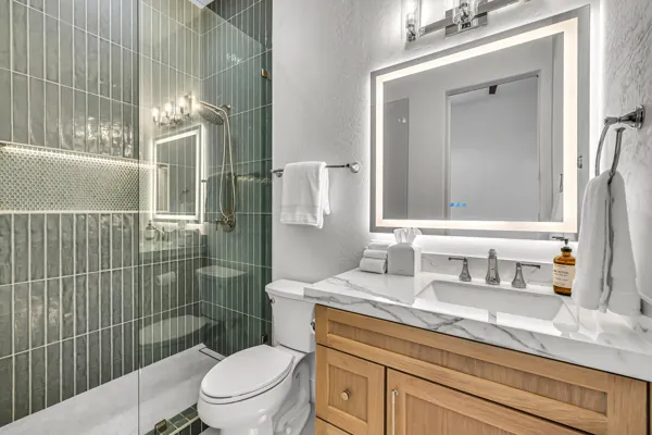 This real estate photography shot features a modern bathroom in Scottsdale, AZ with elegant marble countertops and sleek fixtures.