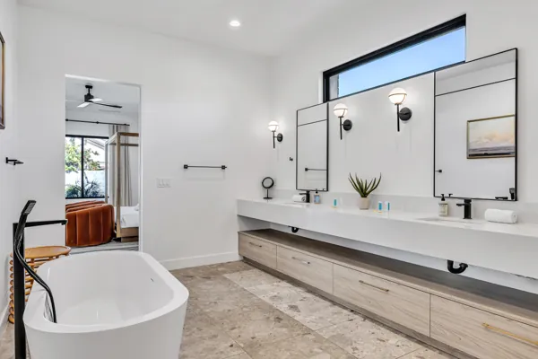 Modern bathroom with double vanity and freestanding tub in Scottsdale, AZ, captured with expert real estate photography for a clean and stylish home interior.