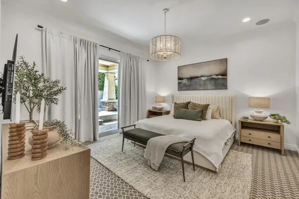 This real estate photography showcases a modern bedroom in Mesa, AZ, with elegant decor and natural lighting.