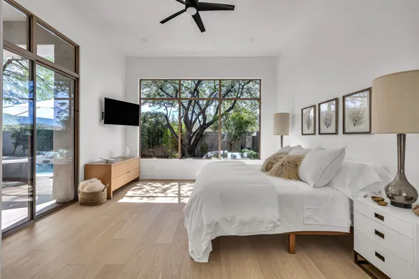 Experience luxurious living in Scottsdale, AZ with this stunning bedroom, showcasing exquisite real estate photography on E Caribbean Ln.