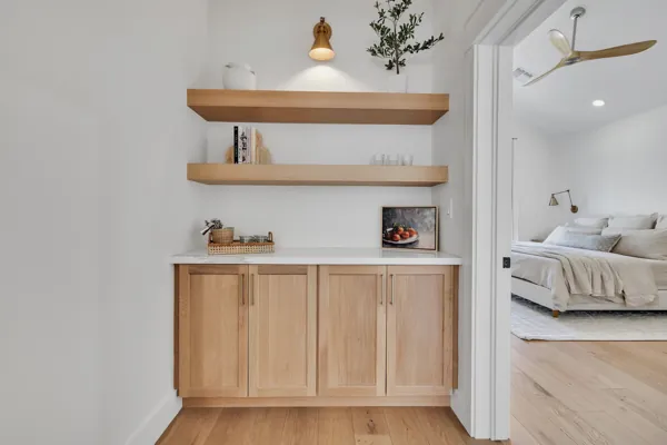 Explore luxury real estate photography in Phoenix, AZ, showcasing modern interiors with elegant wooden shelves and refined decor.