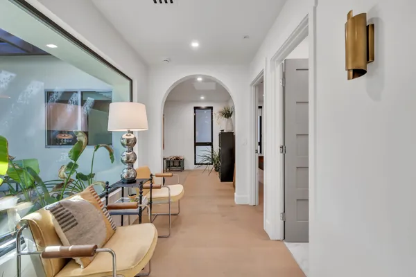 Discover luxury real estate photography showcasing a beautifully designed home interior in Scottsdale, AZ, featuring a modern hallway with elegant decor and natural light.