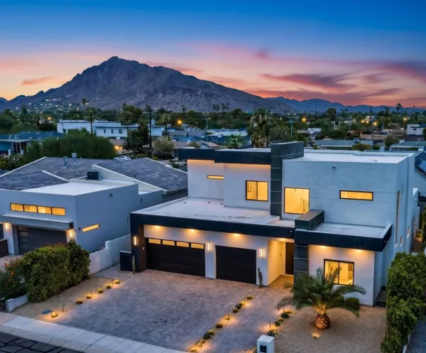Beautiful modern home exterior at twilight on 4th St in Scottsdale, AZ, showcasing stunning architecture and mountain views captured with expert real estate photography.