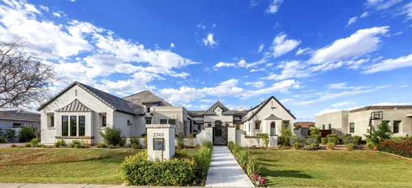Explore luxury real estate photography of a stunning single-story home in Gilbert, AZ, showcasing exquisite design and landscaping.
