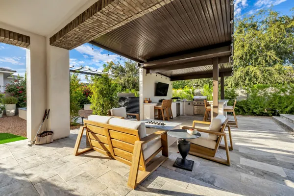 This luxury real estate photography showcases a stunning outdoor seating area in Gilbert, AZ, exemplifying elegance and comfort.