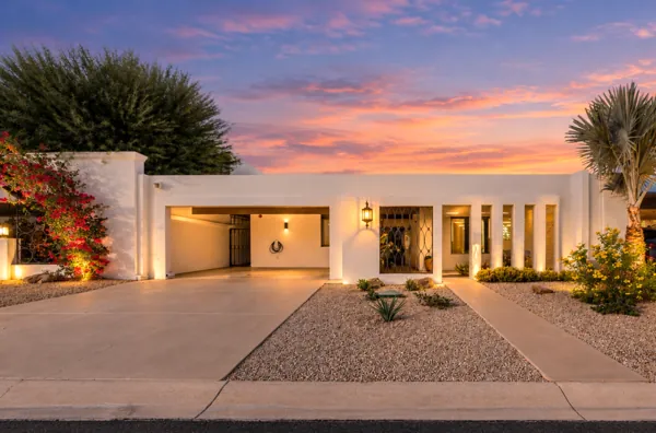Experience luxury real estate photography with this stunning modern home in Scottsdale, AZ, set against a beautiful sunset backdrop.