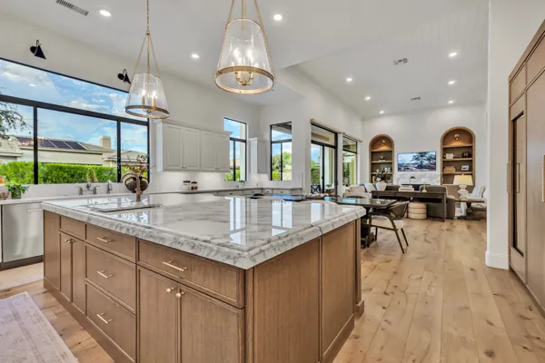 Explore luxury real estate photography showcasing a stunning kitchen design in Gilbert, AZ, featuring a modern layout and elegant finishes.