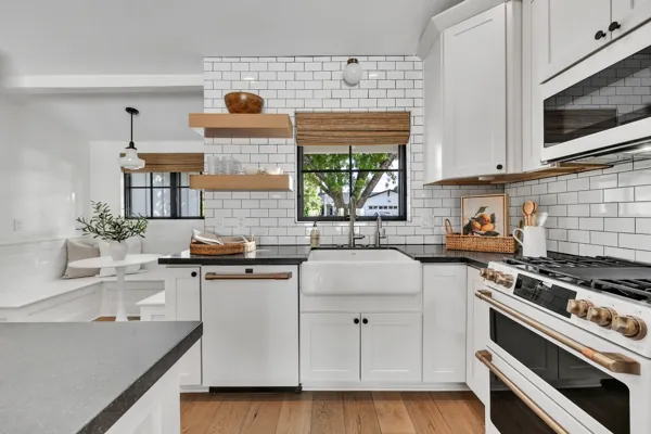 Explore this beautifully designed kitchen in Phoenix, AZ, showcasing luxury real estate photography with its modern farmhouse elements and sleek aesthetics.