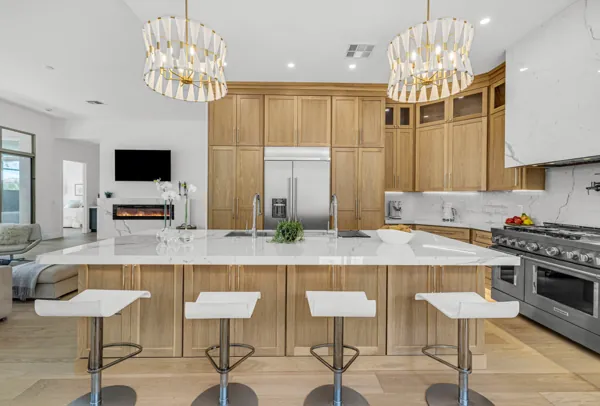 Discover stunning real estate photography featuring a modern kitchen in Scottsdale, AZ, highlighting a spacious marble island and contemporary design.