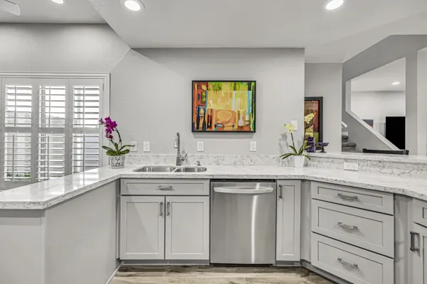 This luxury real estate photography showcases a modern kitchen with marble countertops in a Scottsdale, AZ home.