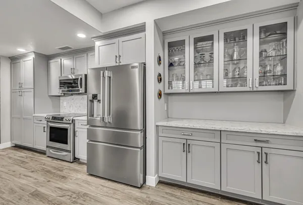 Explore luxury real estate photography showcasing a modern kitchen with stainless steel appliances in Scottsdale, AZ.