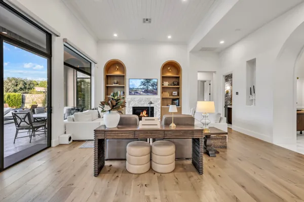Explore this stunning luxury real estate photography showcasing a beautifully designed living room in Gilbert, AZ with elegant modern furnishings and a cozy fireplace mood.