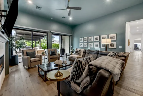 Discover luxury real estate photography showcasing a stylish living room with modern decor and expansive windows in Gilbert, AZ.