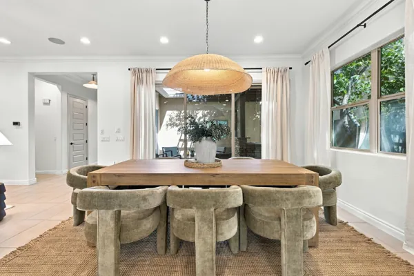 Explore this beautifully lit dining room in a Mesa, AZ home, showcasing exceptional real estate photography.