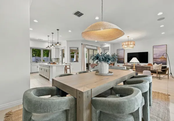Explore stunning real estate photography capturing a modern kitchen and living room design on E Telemetry Dr, Mesa, AZ, highlighting elegant and functional living spaces.