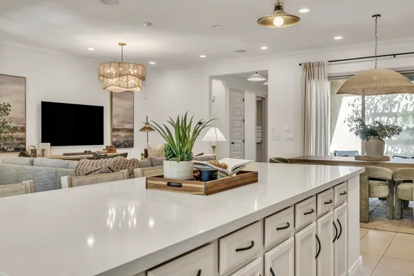 Explore the beautifully designed modern kitchen in this real estate photography showcase in Mesa, AZ, capturing inviting decor and ample natural light.
