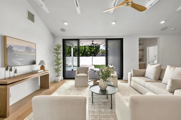 This luxury real estate photography showcases a stylish living room in Phoenix, AZ, featuring modern furnishings and elegant decor.