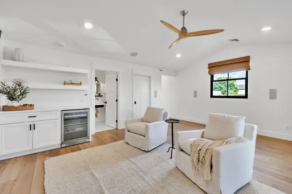 This luxury real estate photography showcases a modern living area in Phoenix, AZ, featuring elegant furnishings and natural light.