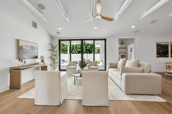 Explore luxury real estate photography showcasing a modern living room in Phoenix, AZ, featuring elegant furnishings and ample natural light.
