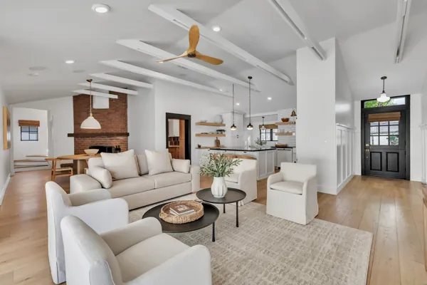 This luxury real estate photography captures a stunning open-concept living area located on E Avalon Dr, Phoenix, AZ, showcasing modern design elements.