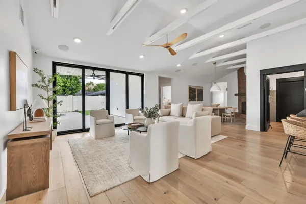 Explore luxury real estate photography highlighting a spacious modern living room in Phoenix, AZ, featuring elegant design and abundant natural light.