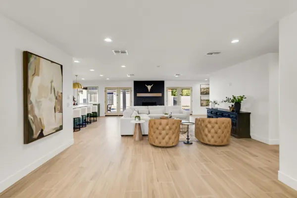 This spacious living room in Phoenix, AZ features modern furniture and a bright open layout, captured beautifully through professional real estate photography.