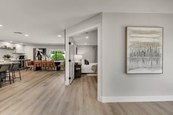 This elegant real estate photography showcases a modern living and dining area in Scottsdale, AZ, highlighting contemporary design and natural light.