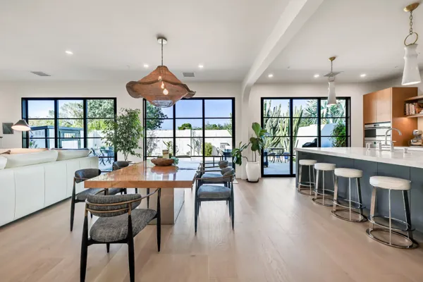 Discover stunning luxury real estate photography showcasing a modern open-concept living and dining area in Scottsdale, AZ, highlighting elegance and style.