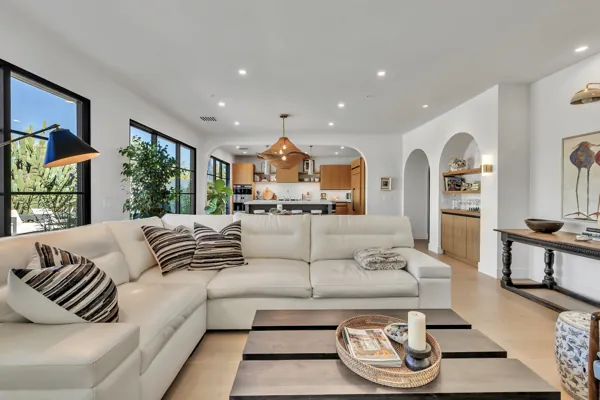This luxury real estate photography showcases a spacious living room with modern decor in a Scottsdale, AZ home, highlighting elegant design and bright interiors.