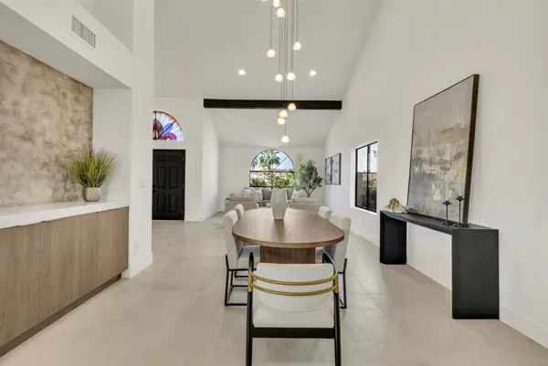 This modern dining and living area in Scottsdale, AZ features clean lines and natural light, captured beautifully through expert real estate photography.