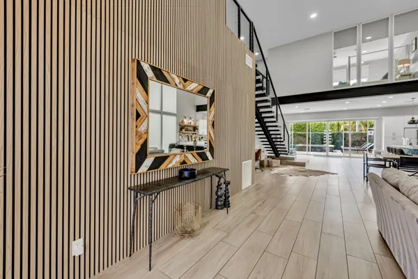 Spacious modern living room in Scottsdale, AZ, perfect for an Airbnb photo shoot highlighting wooden accents and open design.