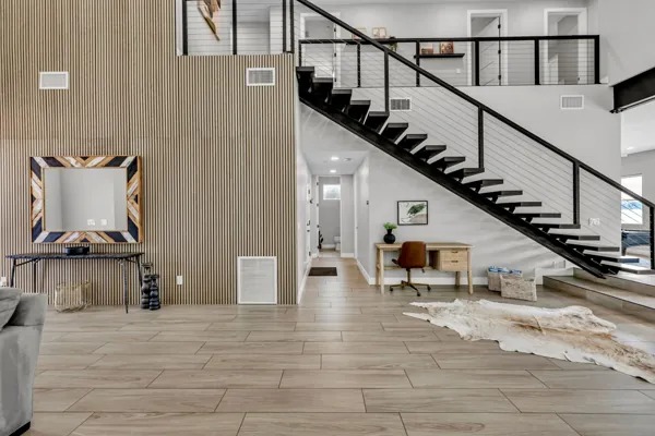 This stunning Scottsdale, AZ property features a modern staircase and stylish workspace, perfect for an Airbnb photo shoot.