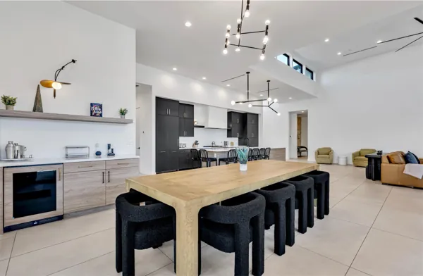 This Scottsdale, AZ home features a modern open layout with a spacious kitchen, dining area, and living room captured with professional real estate photography.