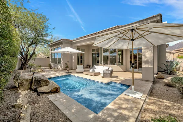 This real estate photography showcases a serene backyard pool area in Scottsdale, AZ, providing a glimpse into luxurious outdoor living.