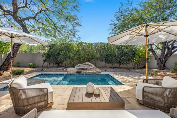 Experience luxury living with this stunning real estate photography showcasing a poolside oasis in Scottsdale, AZ, ideal for relaxation and entertainment.
