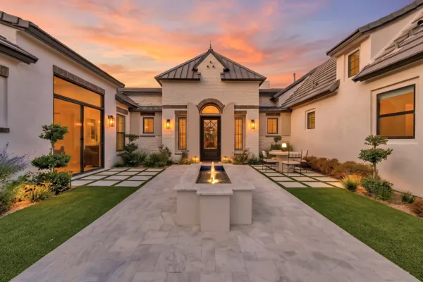 Experience the stunning luxury real estate photography of this exquisite courtyard at sunset, located in Gilbert, AZ.