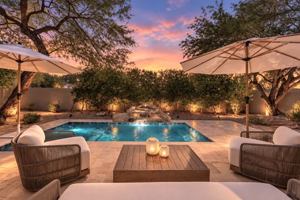Experience exquisite real estate photography with a stunning patio and pool view located in Scottsdale, AZ, showcasing perfect outdoor living.